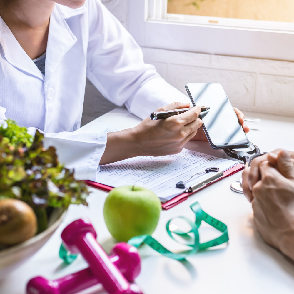 Nutritionist giving consultation to patient with healthy fruit and vegetable, Right nutrition and diet concept